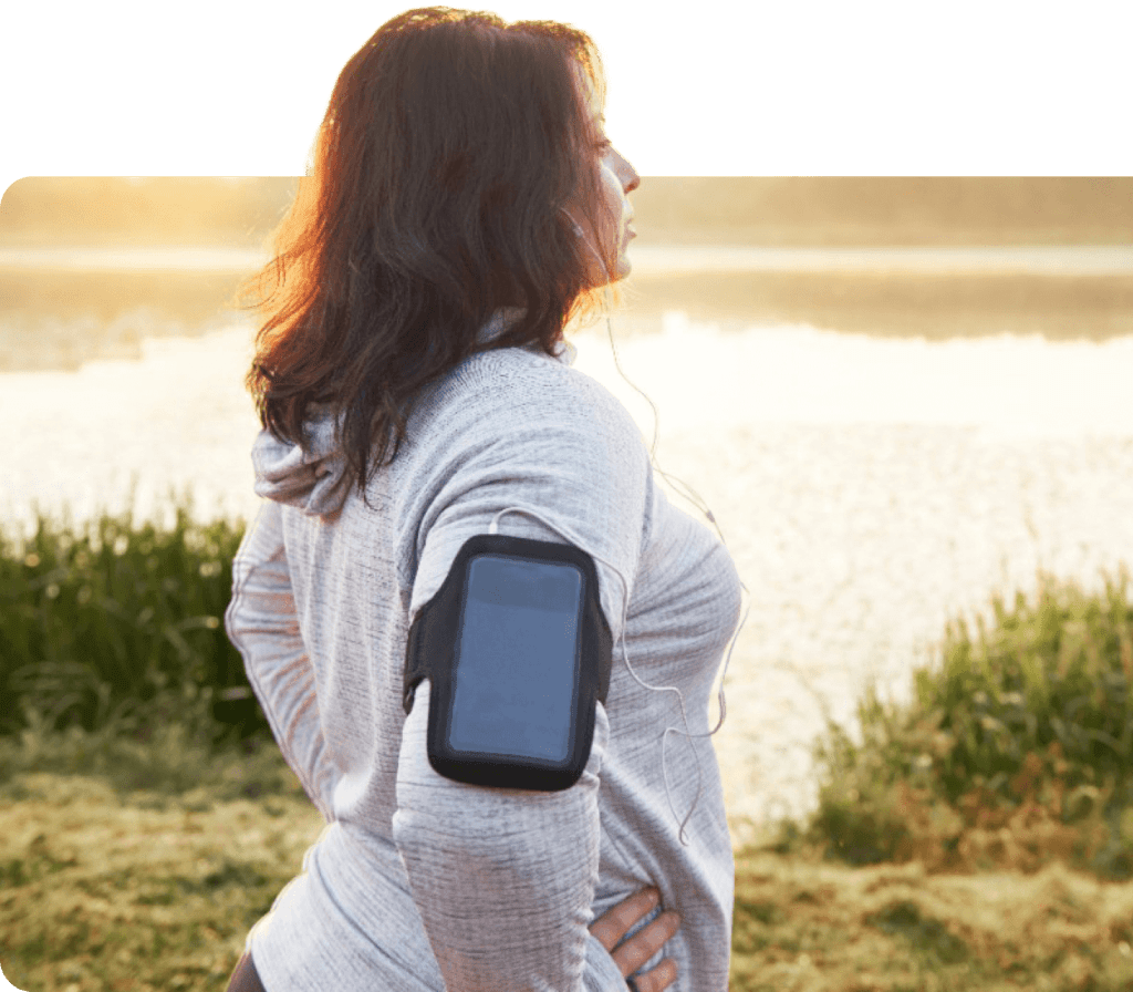 Image of a woman exercising by a lake