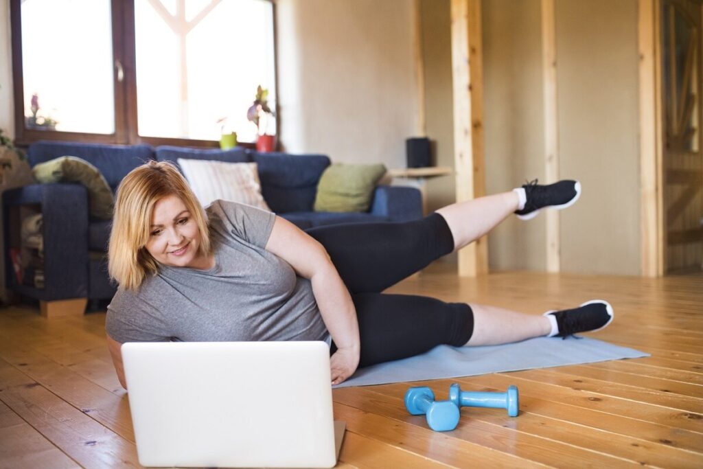 Woman exercising as part of preoperative weight optimization for hernia repair