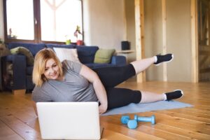 Woman exercising as part of preoperative weight optimization for hernia repair
